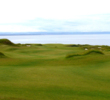 The 555-yard, par-5 closer at The Castle Course is a massive, downhill left-to-right dogleg.