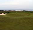 The enormous green at the 540-yard, par-5 fourth hole features three tiers, all running downhill from the fairway.