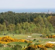 The long, par-4 seventh hole on the Duke's Course heads downhill toward the sea and town in the background. 