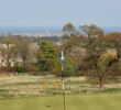 The 18th green is perched on one of the highest spots on The Duke's Course and is in view of the town a mile away. 